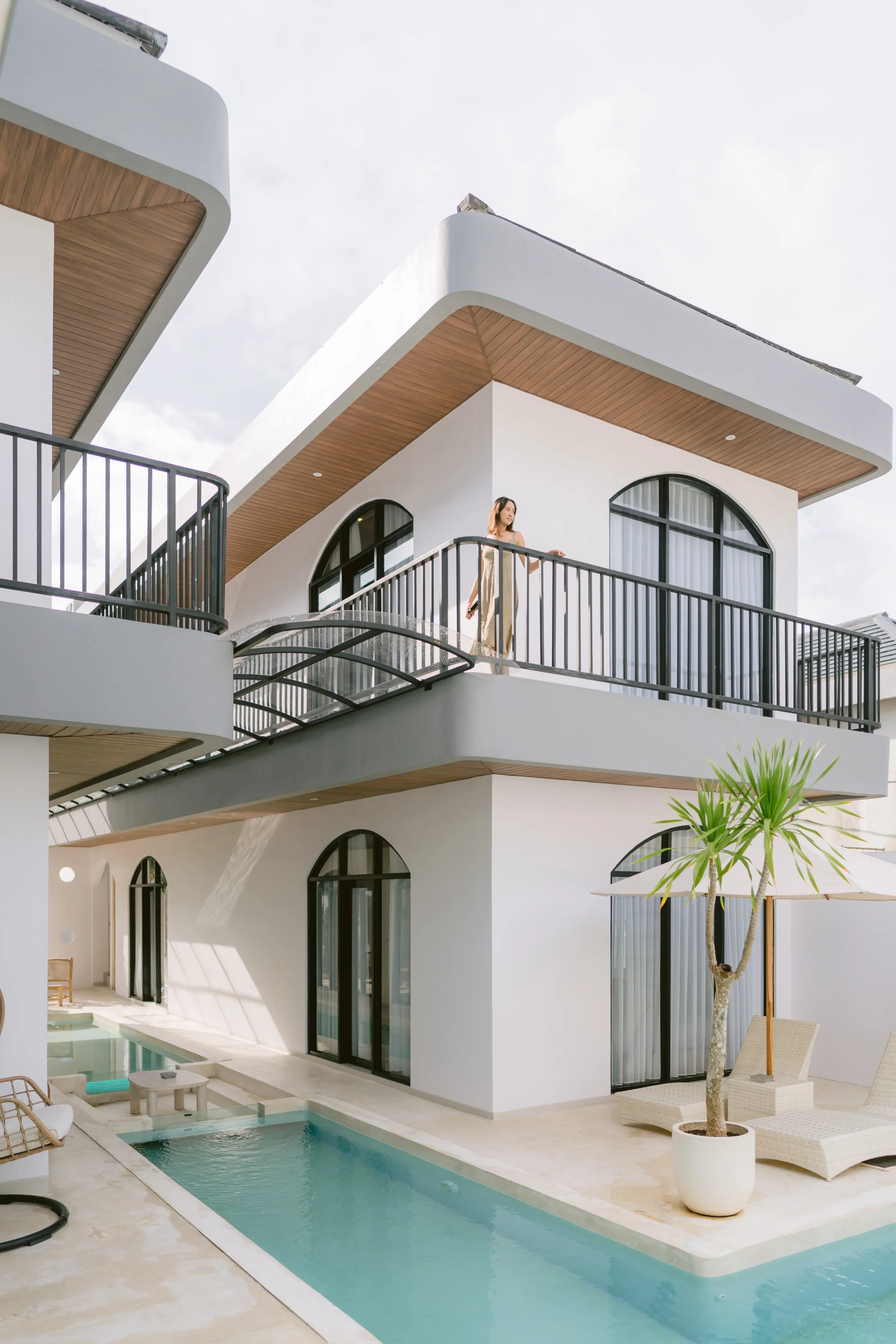 Bedroom with arched grid headboard and full mirror