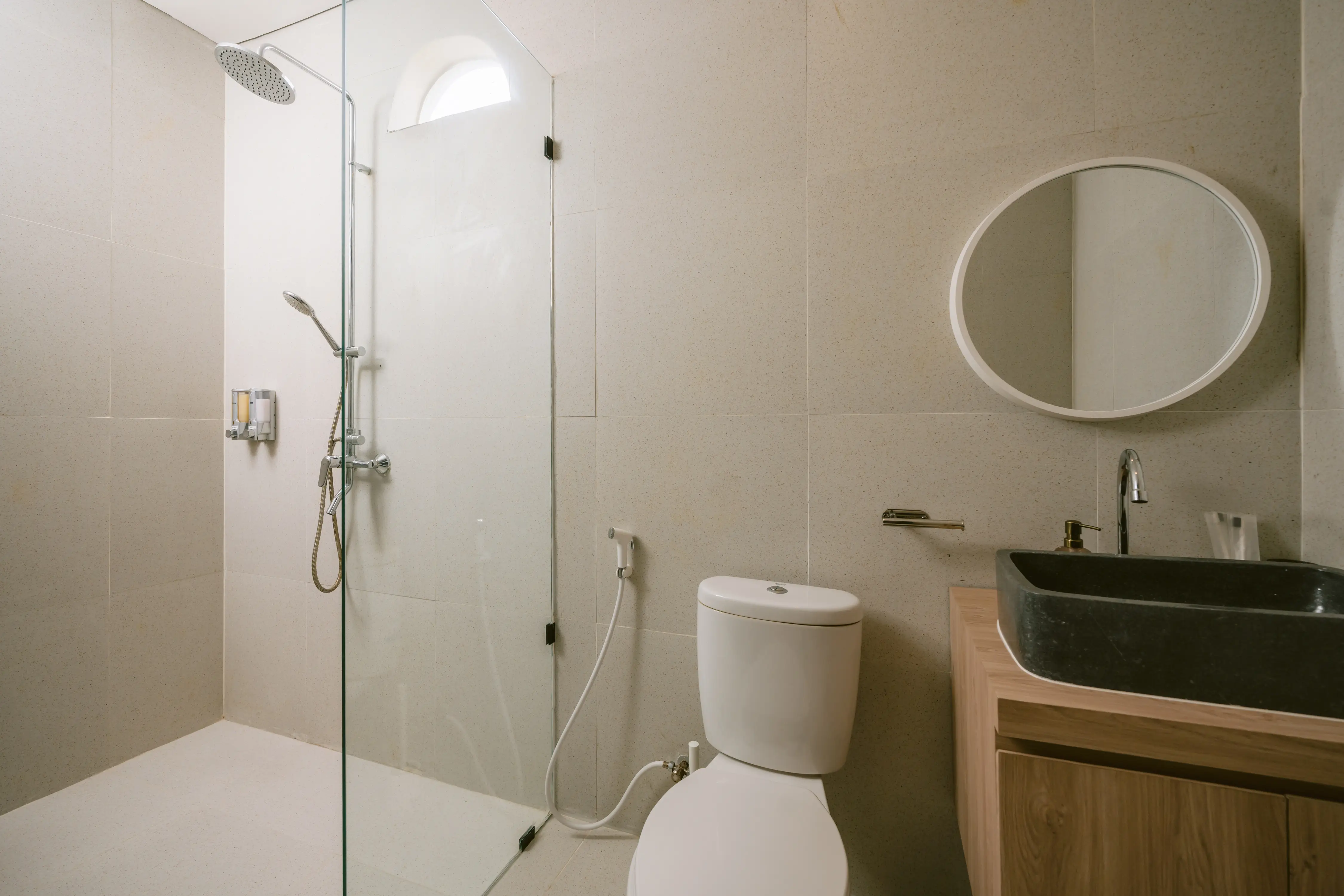 Bathroom with carved black stone basin