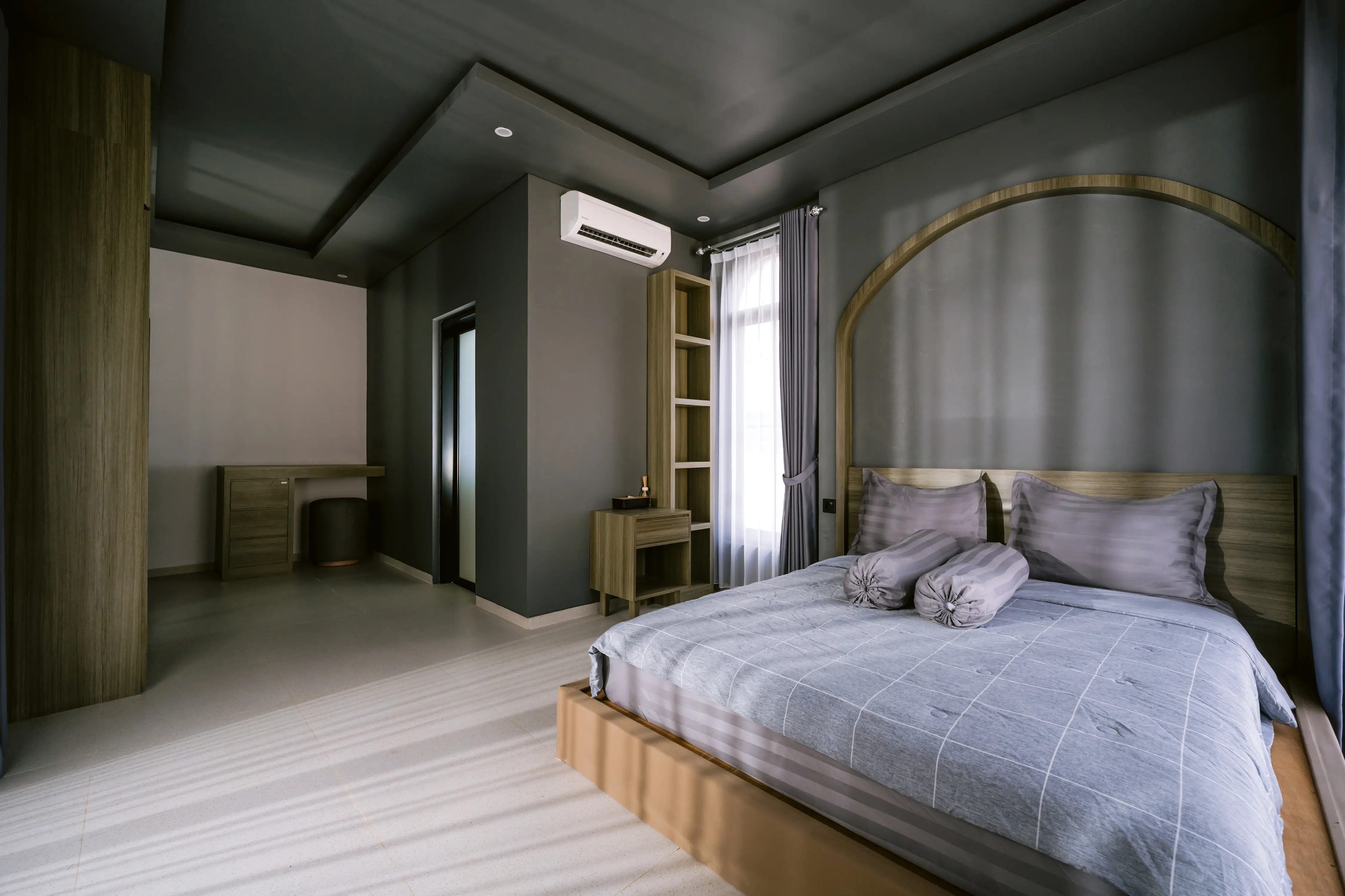 Master suite wide angle showing dressing area and bed