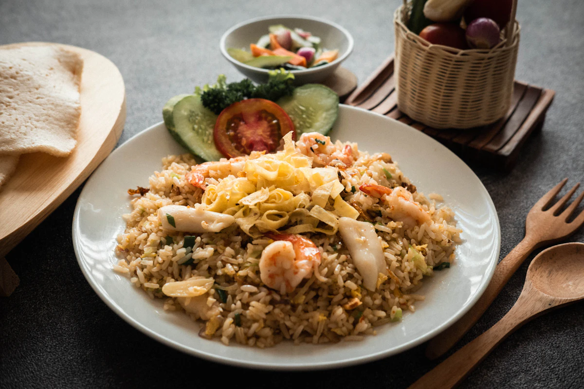 A plate of Indonesian nasi goreng with shrimp and vegetables — typical kid-friendly Bali meal