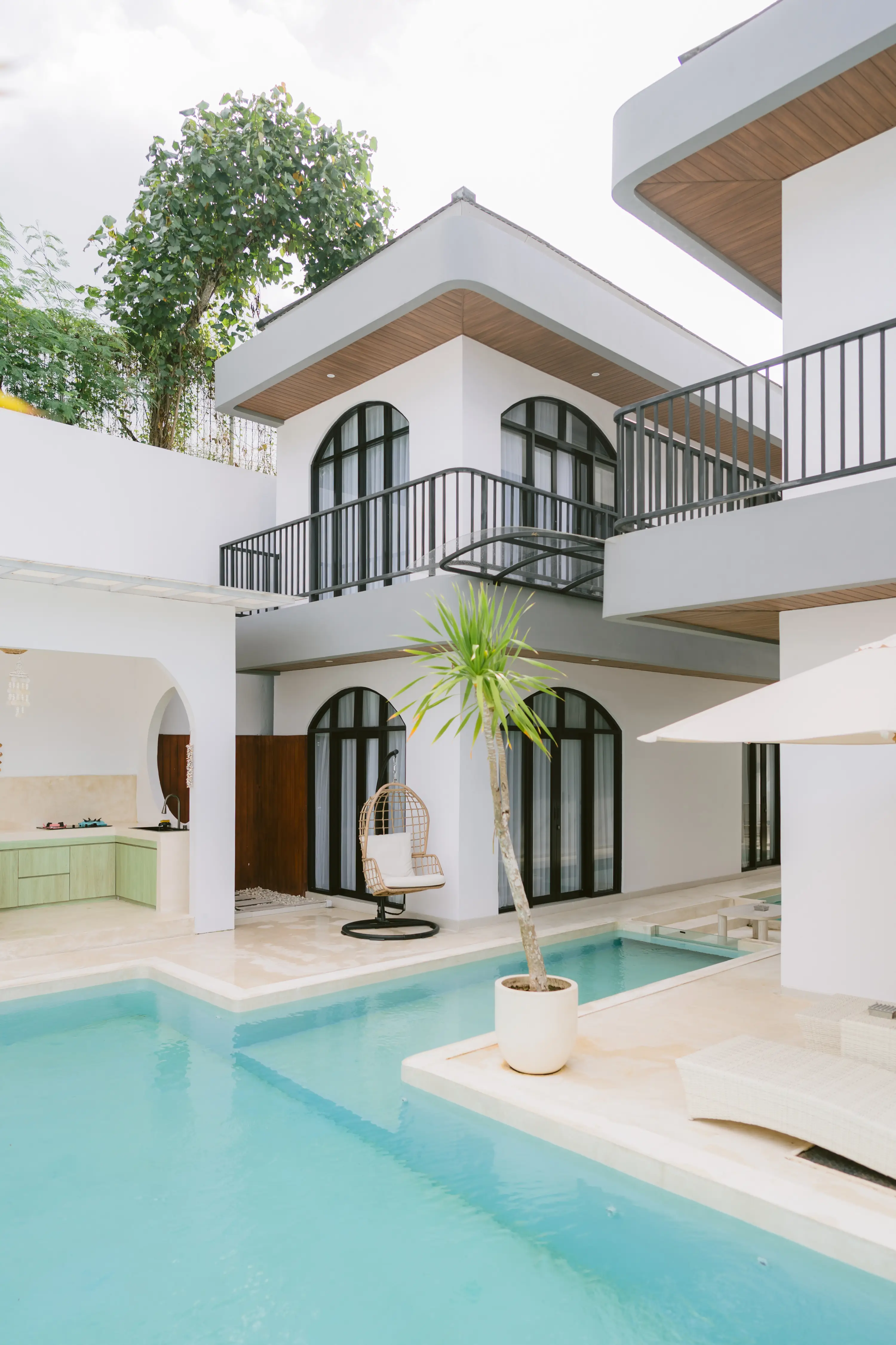 Bedroom with arched grid headboard and full mirror